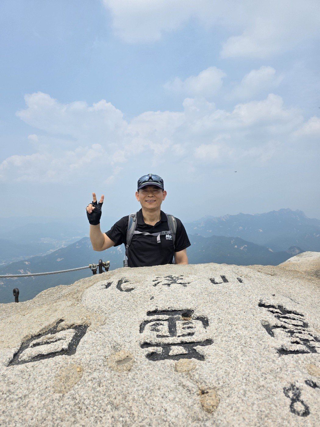 The guide at a mountain summit in Korea